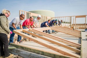 Self-Help Enterprises-Families raising the walls of their new home 2014